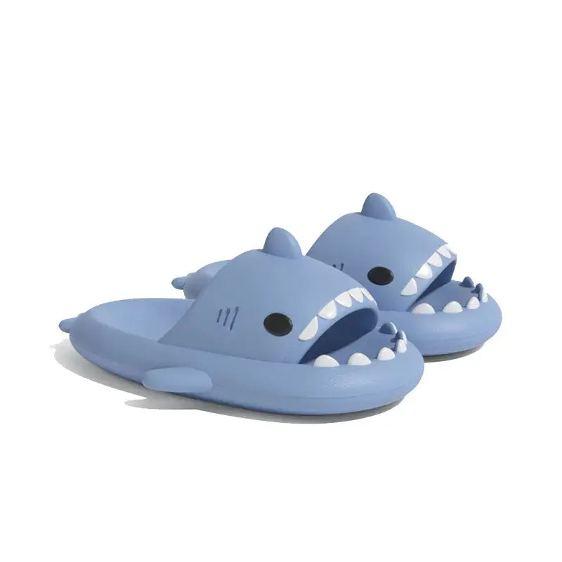 Blue shark design slippers, featuring a cute design and cozy fit for relaxing.
