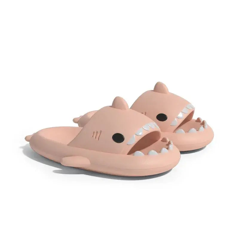 Pink shark design slippers, perfect for lounging with a fun and cozy style.
