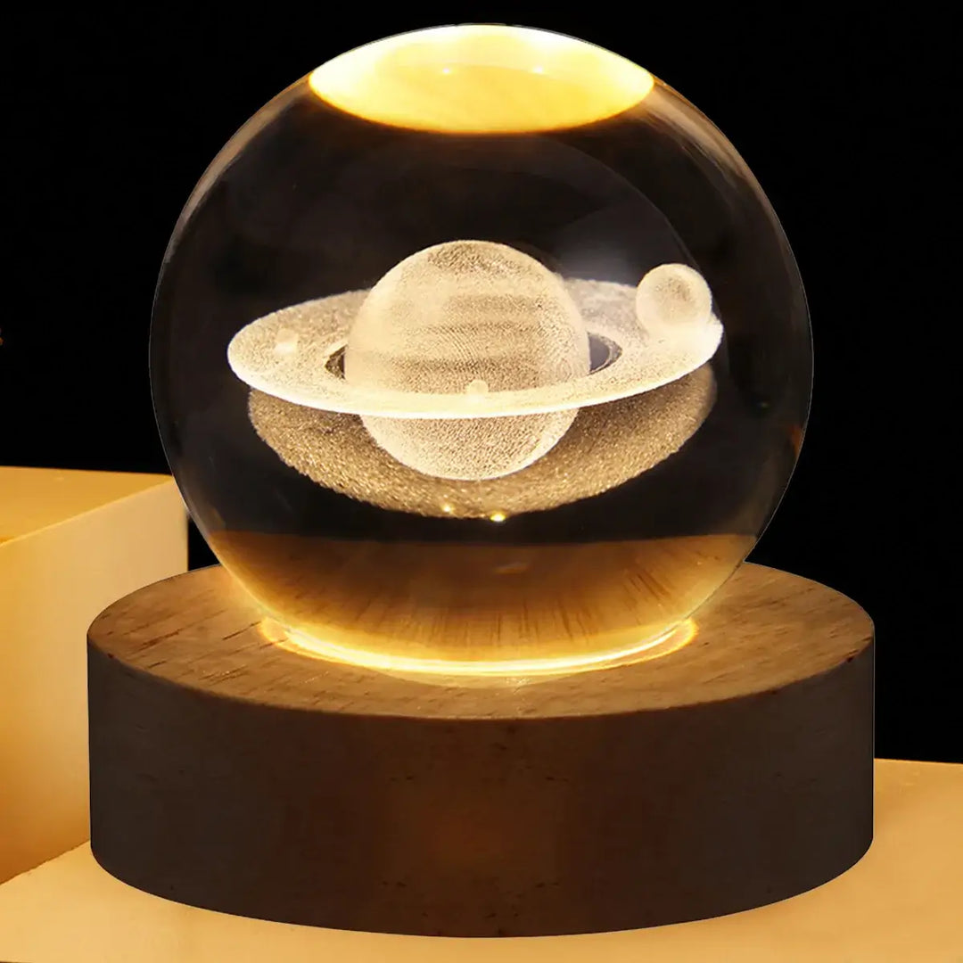 Stunning crystal ball LED night light projecting galaxy patterns in a dimly lit room.
