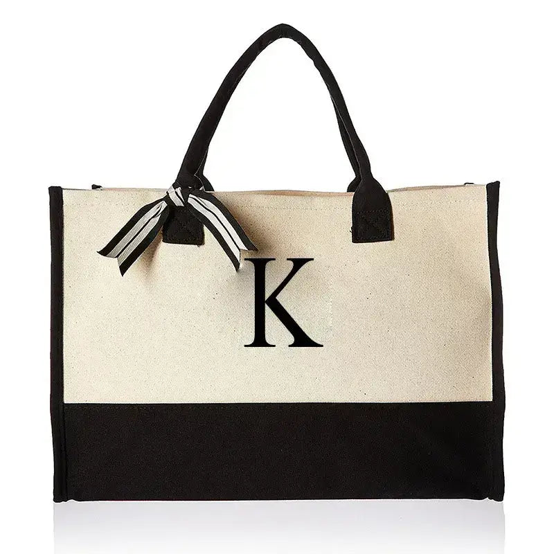 Chic bag adorned with letter K, designed for those who love trendy accessories. Spacious and practical, it’s perfect for everyday use and outings.