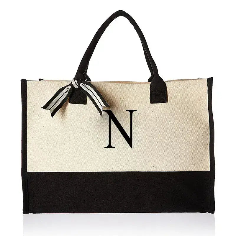 Elegant bag adorned with letter N, designed for versatility and chic styling. Perfect for everyday use and casual outings while keeping your essentials safe.