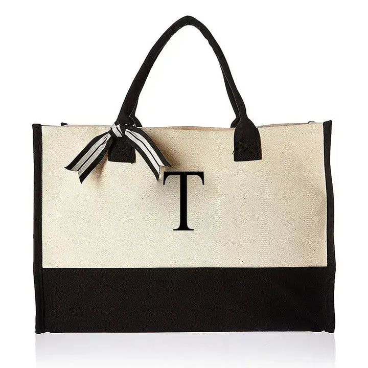 Stylish bag showcasing letter T, designed for versatility and chic everyday wear. Ideal for carrying your essentials in style and comfort on any outing.