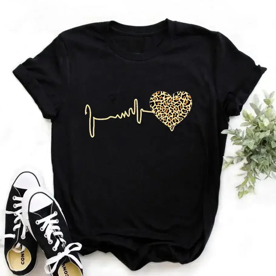 Stylish black 90s Graphic Women's Tee featuring a leopard heartbeat print. Perfect for casual outings or expressing retro fashion.