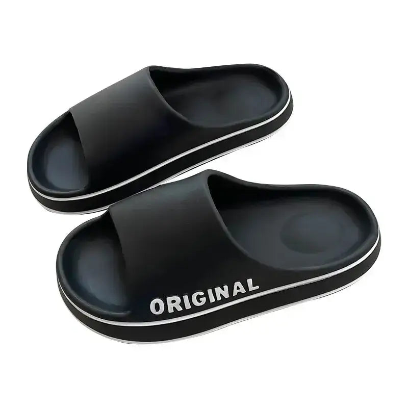 Sleek black anti-slip couple slippers designed for both men and women, offering comfort and style for everyday wear, perfect for both indoor lounging and outdoor adventures.