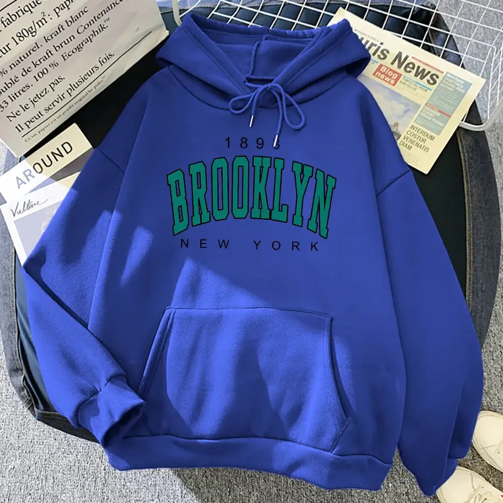 Trendy blue Brooklyn hoodie featuring a striking print, perfect for urban casual wear