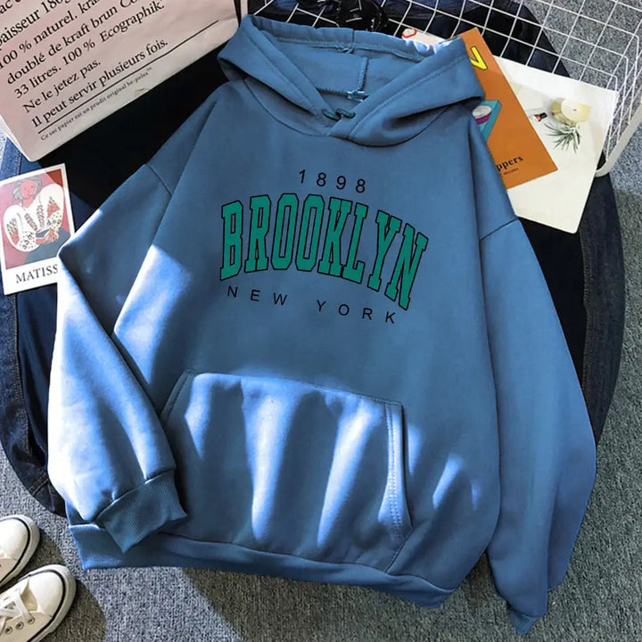 A detailed look at the bold statement print on the Brooklyn Hoodie, reflecting the spirit of NYC. Perfect for making a fashion statement.