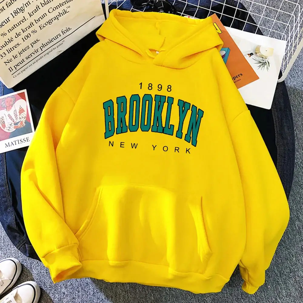 Bright yellow fleece Brooklyn hoodie with iconic print, ideal for comfort and urban fashion