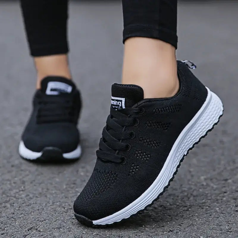 BX Casual Women's Shoes in classic black, featuring a versatile design that combines style and comfort for everyday wear and workouts.