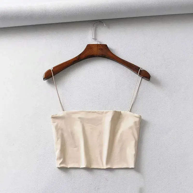 Stylish beige elastic women's crop top, crafted from soft knitted material, perfect for a casual yet fashionable look in any season.