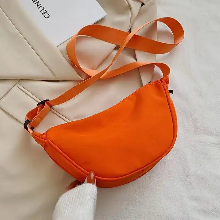 Eye-catching orange BX Fashion Designer Women's Handbag, combining fashion and functionality with a trendy silhouette.