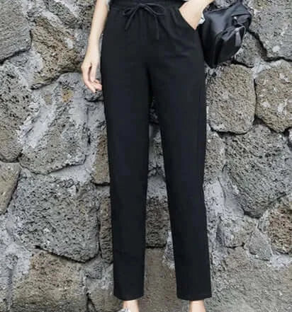 Introducing BX Solid Elastic Waist Women's Pants in timeless black, featuring a relaxed fit and breathable fabric. A must-have for every woman's closet.