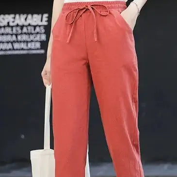 Brighten your wardrobe with BX Solid Elastic Waist Women's Pants in lively orange. These pants provide a perfect blend of style and comfort for any casual event.