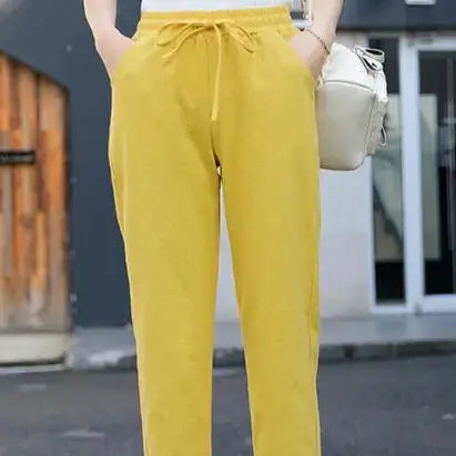 Add a pop of color with BX Solid Elastic Waist Women's Pants in cheerful yellow. These stylish pants are designed for comfort and will elevate any casual look.