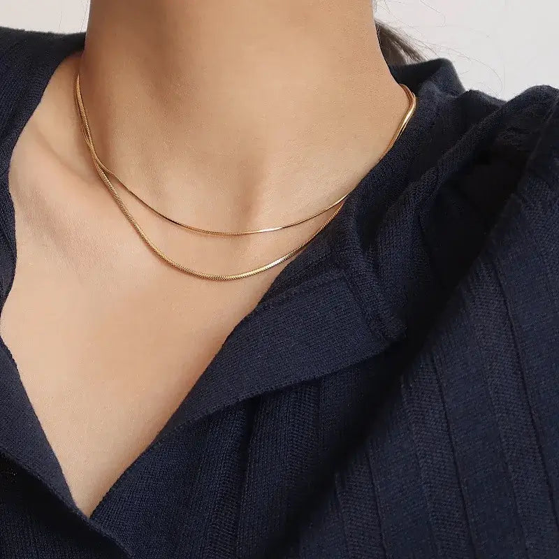 A sleek silver chain choker necklace, designed to complement various outfits, perfect for casual and formal occasions.