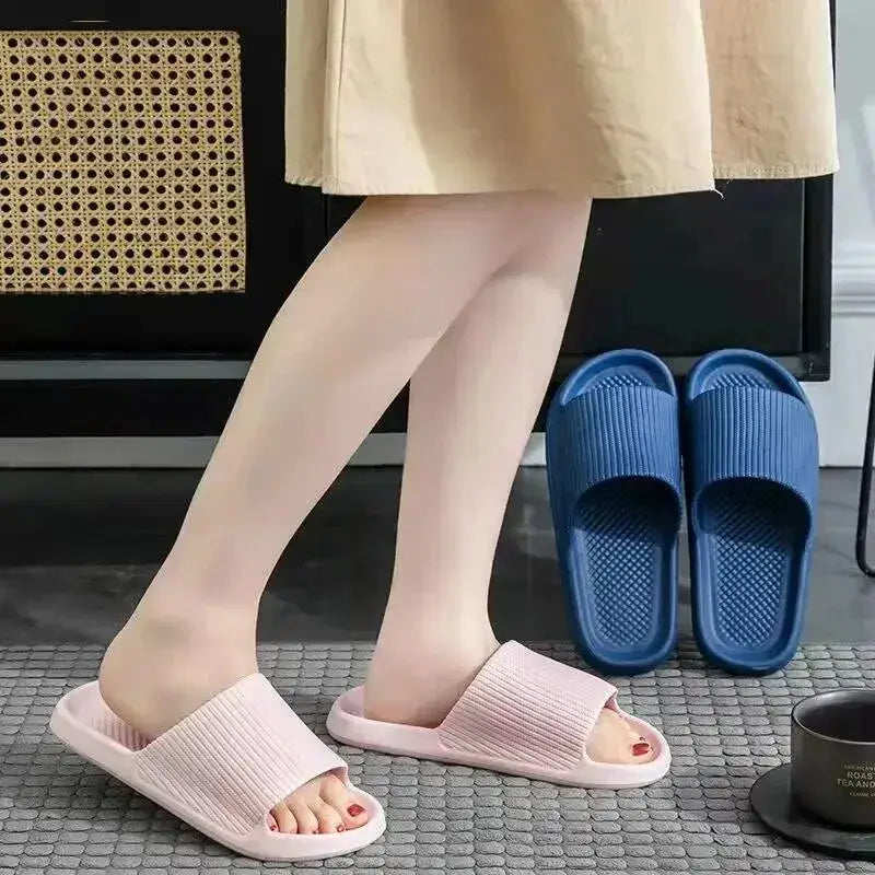 A model showcases our adorable couple slippers in pink and black. These cozy, stylish slippers are perfect for couples looking to relax in comfort.





