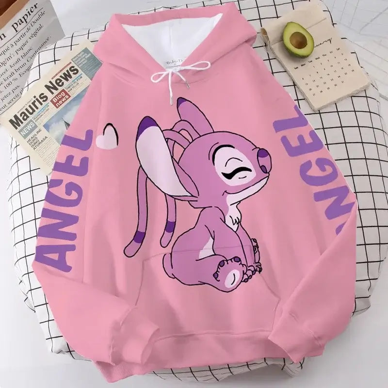 Charming pink Disney-themed sweatshirt with a fun patchwork pattern. Ideal for adding a pop of color and warmth to your winter wardrobe.