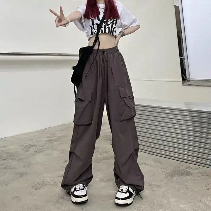 Trendy grey Baggy Y2K women's trousers featuring a relaxed fit and soft fabric, perfect for casual outings and stylish streetwear. Elevate your wardrobe with these versatile trousers for comfort and style.