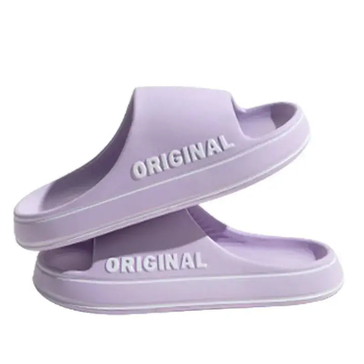 Elegant purple anti-slip couple slippers designed for both men and women, perfect for stylish lounging at home or casual outings.