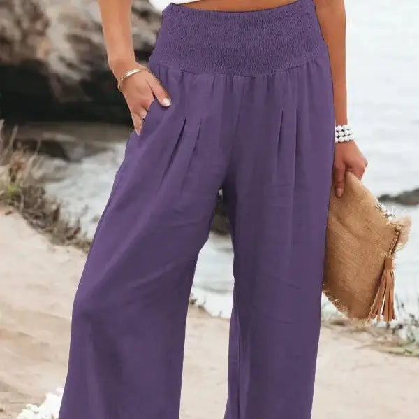 Bold purple elastic waist pants made from soft, durable fabric, combining comfort and style for a trendy casual look that elevates any outfit effortlessly.