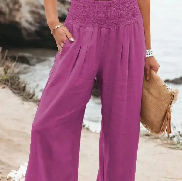 Eye-catching rose red elastic waist pants made with soft and durable fabric, perfect for a trendy casual look, adding a pop of color to your outfit.