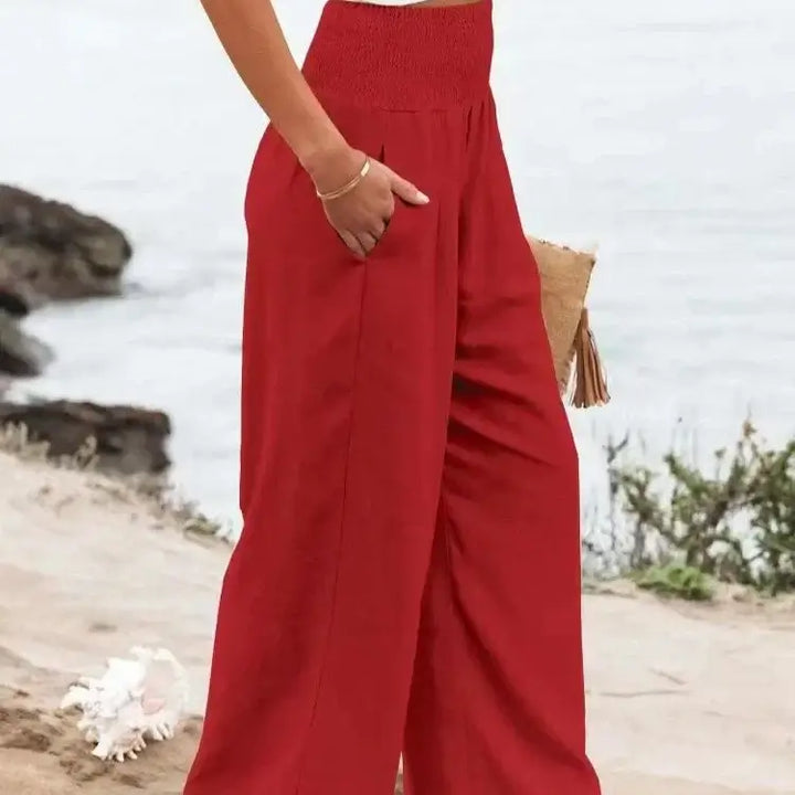 Refreshing watermelon red elastic waist pants crafted from soft fabric, offering durability and a fun, trendy style perfect for casual outings and vibrant outfits.