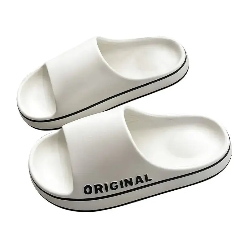 Classic white anti-slip couple slippers designed for both men and women, providing comfort and versatility for everyday wear, ideal for home and casual outings.