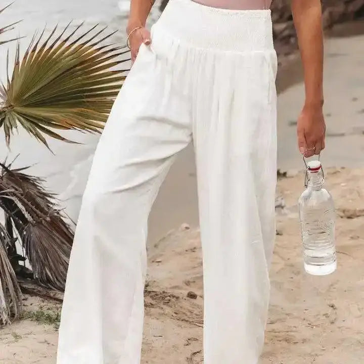 Crisp white elastic waist pants featuring soft, durable material, providing a clean, trendy look that is perfect for casual wear and versatile outfit styling.